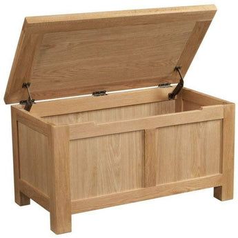 a wooden trunk is sitting in a wooden box 