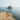aerial photography of man and woman near cliff