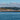 a body of water with land in the back