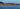 a body of water with land in the back