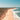 a person flying a kite on a beach
