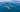 a person swimming with dolphins