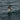 a bird flies over the water