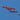 a group of fighter jets flying through a blue sky