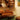A living room filled with furniture and a painting on the wall