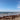 A sunny beach day with clear blue skies.