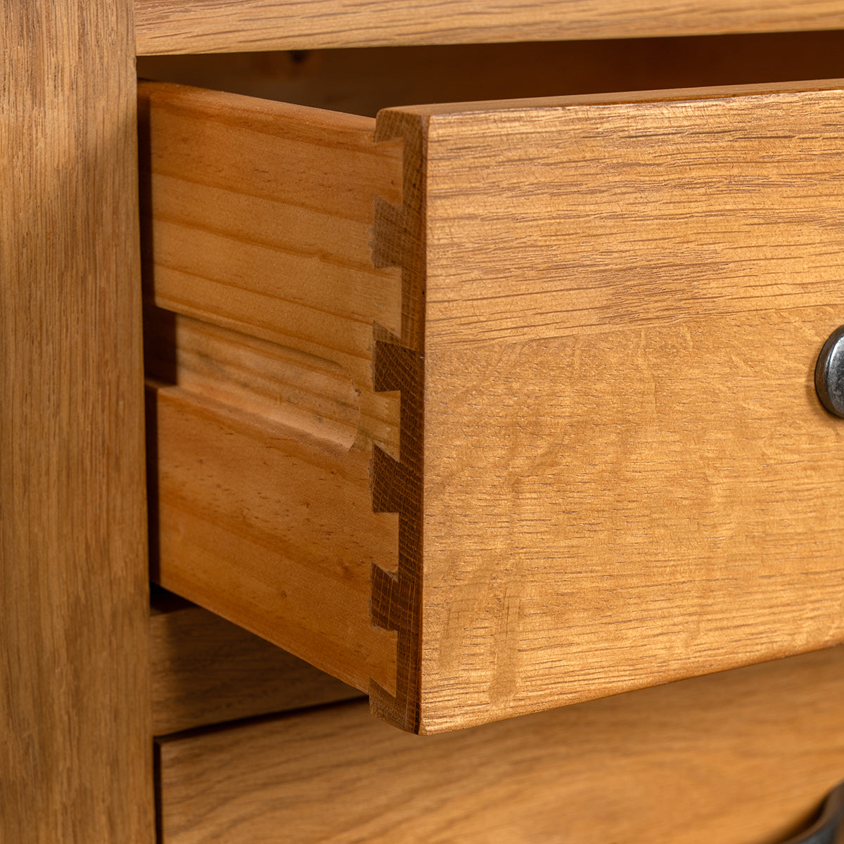a close up of a wooden dresser in a room 