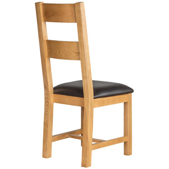 a wooden chair sitting on top of a wooden chair 