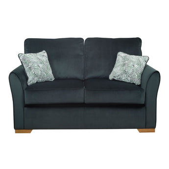 a black leather couch sitting in a living room 