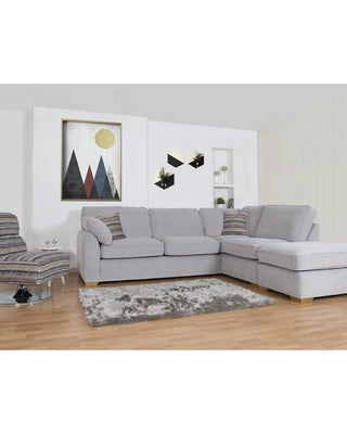 a picture of a living room with a white couch 